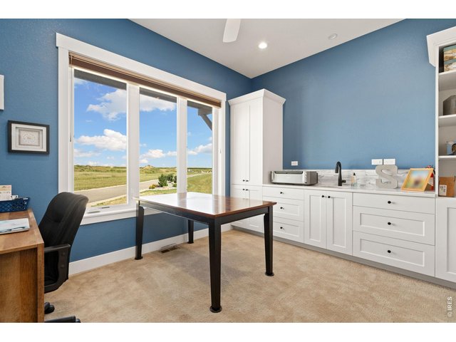 Property Photo 37 Main floor craft room/office with sink and storage!