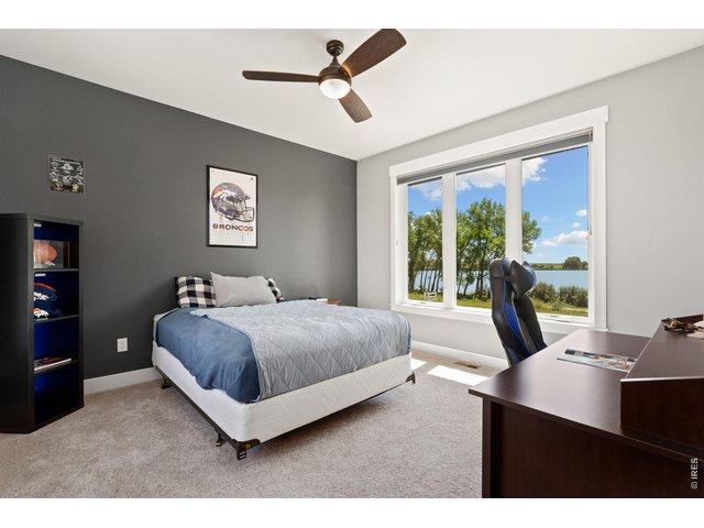 Property Photo 33 2nd main floor bedroom with lake and font of house views.
