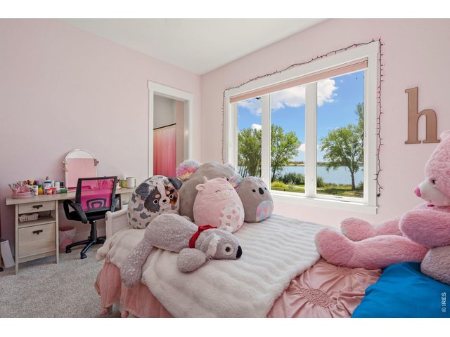 Property Photo 35 3rd main floor bedroom with lake views.