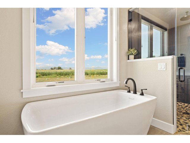 Property Photo 30 This luxury, 5-piece bathroom is the perfect place to soak (or steam) away the long day.
