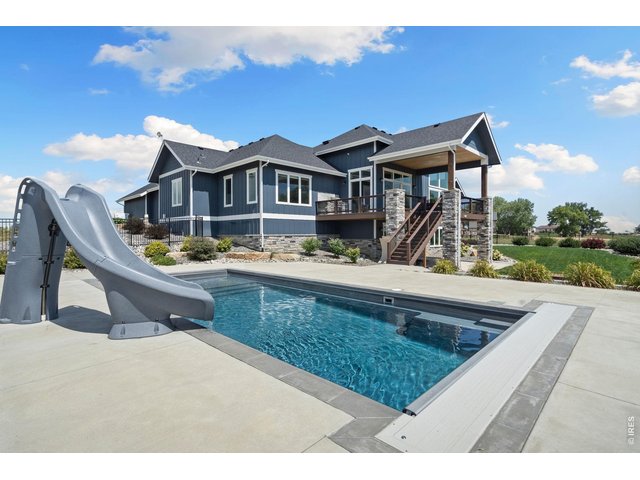 Property Photo 8 Swim laps, relax, or play in your pool with a waterslide!