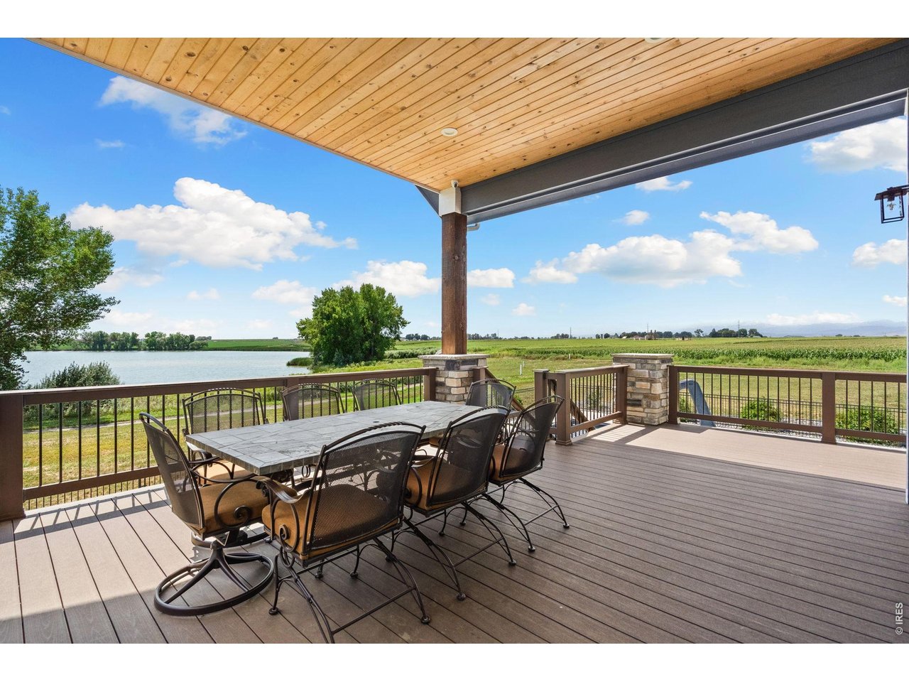 Property Photo 12 Enjoy full lake and mountain views from the upper covered deck.