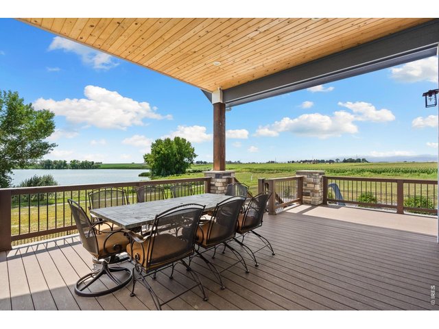 Property Photo 12 Enjoy full lake and mountain views from the upper covered deck.