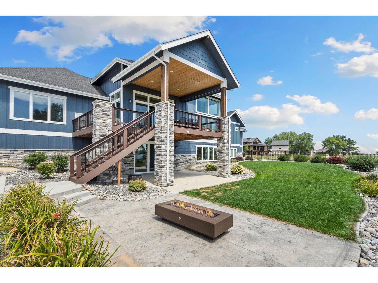 Property Photo 11 Cozy up for smores around your glass and lava rock fire pit.