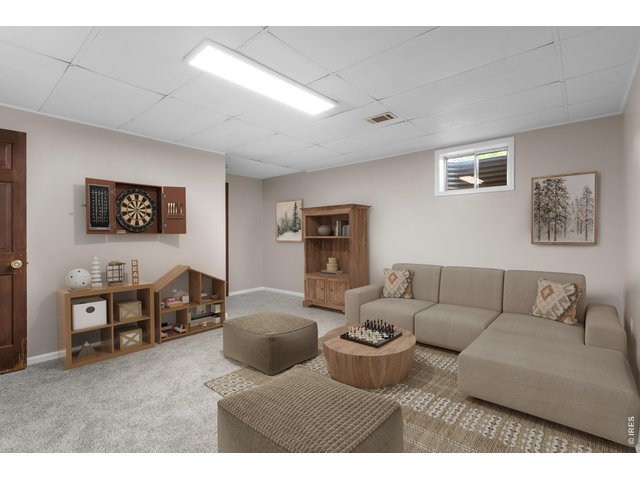 Property Photo 23 Basement Rec/Flex Space (with virtual staging)