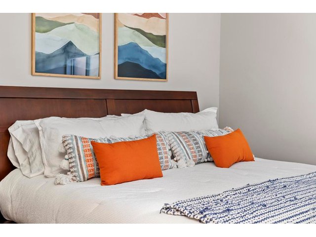 Property Photo 20 Comfortable king sized bed and quality mid-century style bedframe included