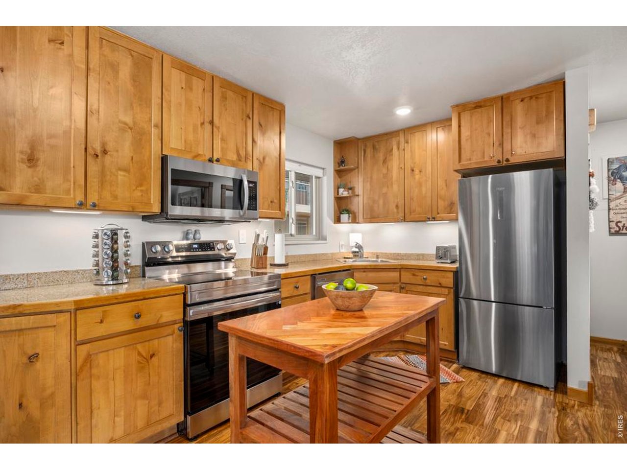 Property Photo 11 Moveable kitchen island provides extra counterspace and storage