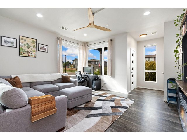 Property Photo 4 Light and bright throughout, the entry opens to a spacious living room.