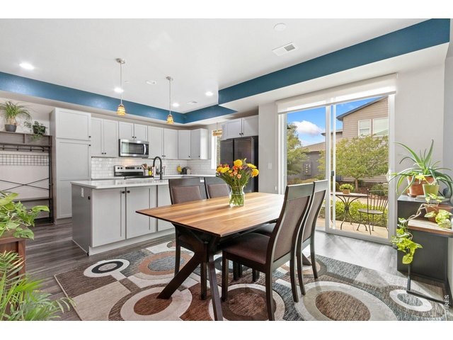 Property Photo 8 Dining space open to kitchen and overlooking a cute side patio.