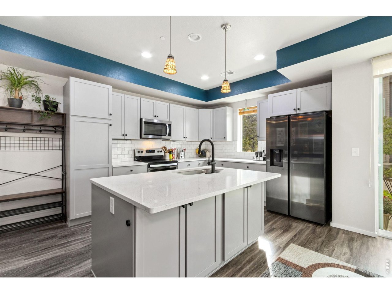 Property Photo 13 Kitchen with pull out storage within cabinetry.