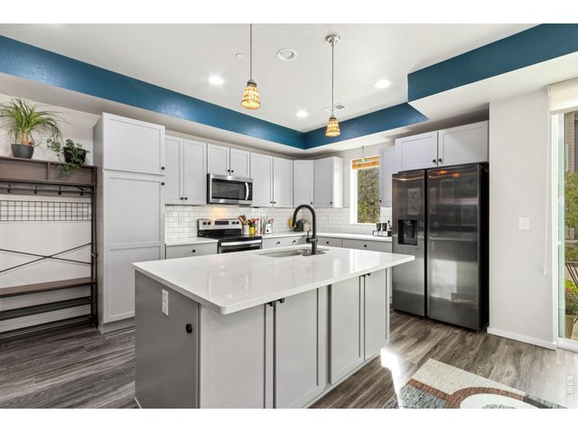 Property Photo 13 Kitchen with pull out storage within cabinetry.