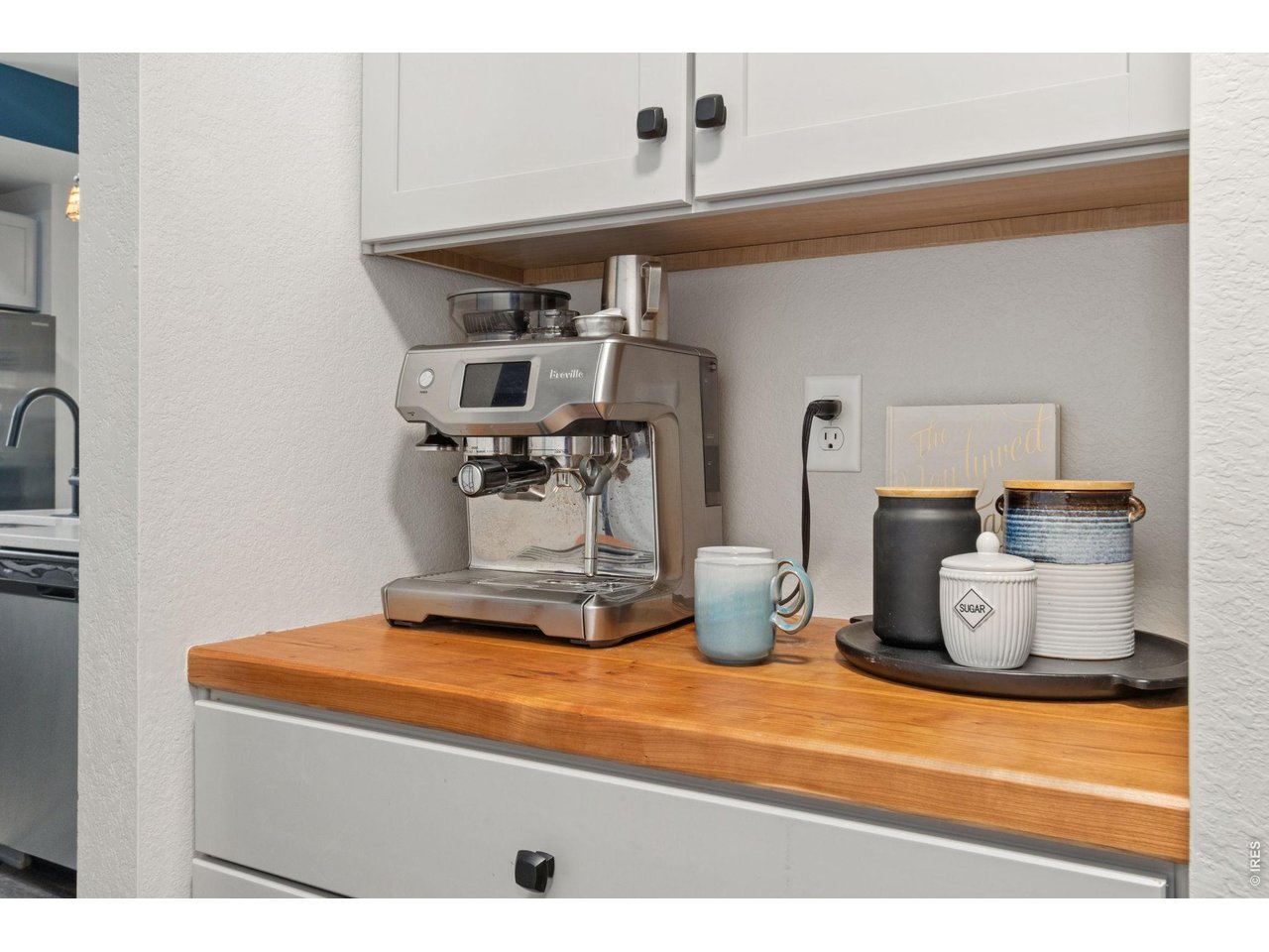 Property Photo 16 Built in coffee bar off the kitchen with butcher block countertop.