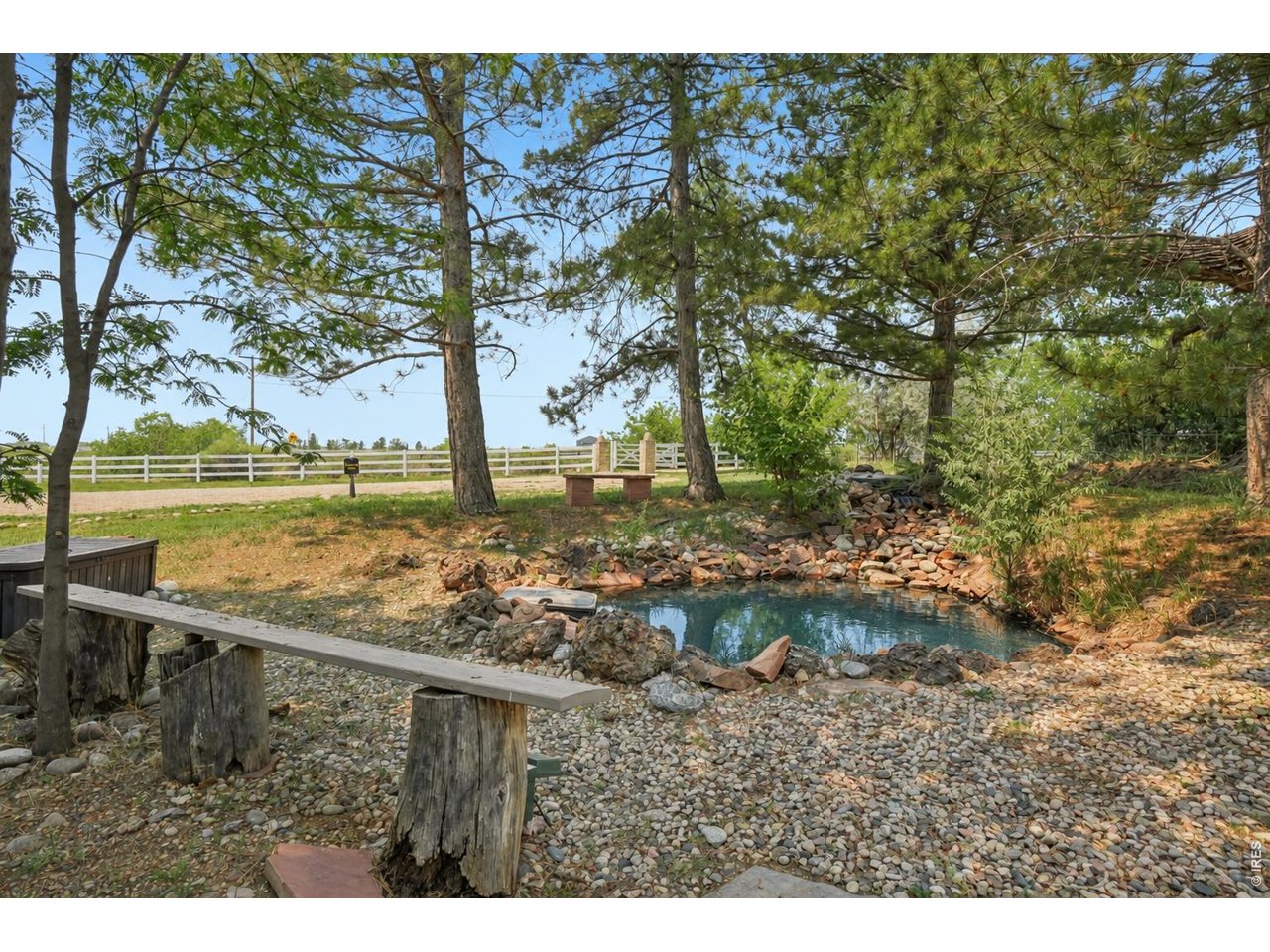 Property Photo 15 The pond, located on the northwest corner of the property, offers peaceful surroundings and beautiful mountain views