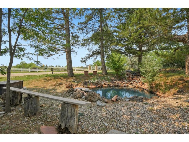 Property Photo 15 The pond, located on the northwest corner of the property, offers peaceful surroundings and beautiful mountain views
