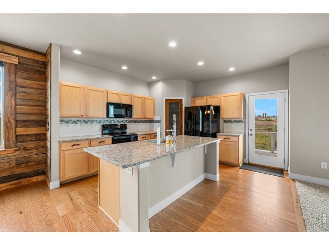 Property Photo 19 Real Hardwood Floors and Black Appliances, Light Maple Cabinets.