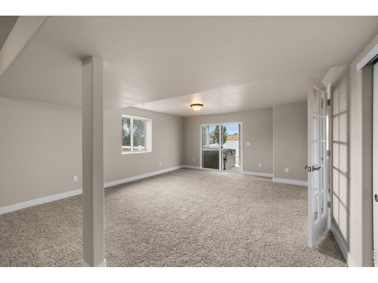 Property Photo 34 Basement Walk-Out Sliding Door and French Doors to Bedroom 5.