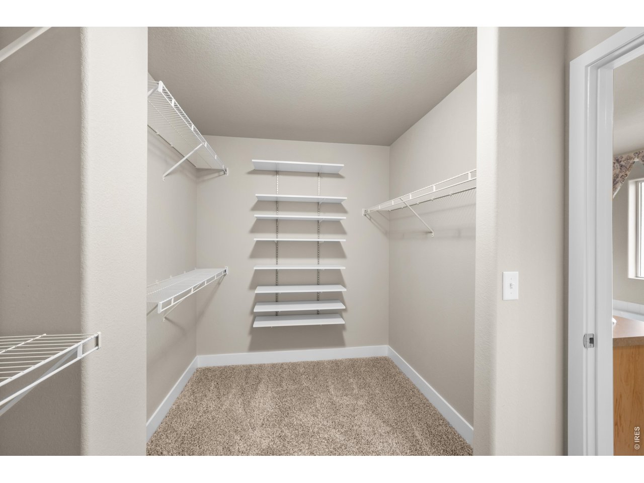 Property Photo 30 Primary Walk-In Closet.