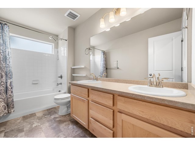Property Photo 33 Full Upper Bathoom with Extended Countertop and Shower/Bath Window.