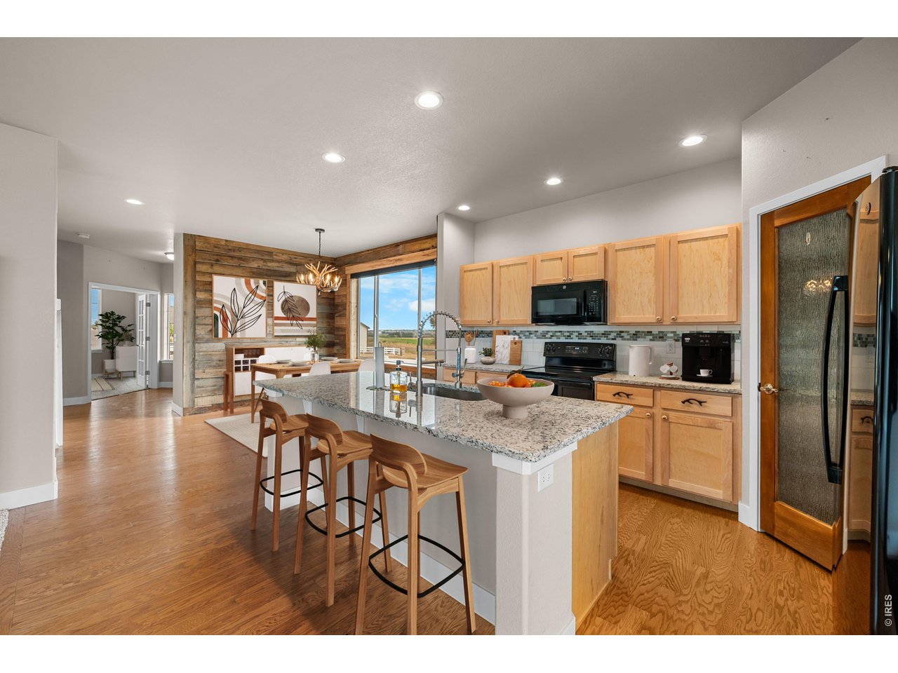 Property Photo 18 White Sparkle Granite Countertops with Ruby Red Flecks. Virtually Staged Photo.