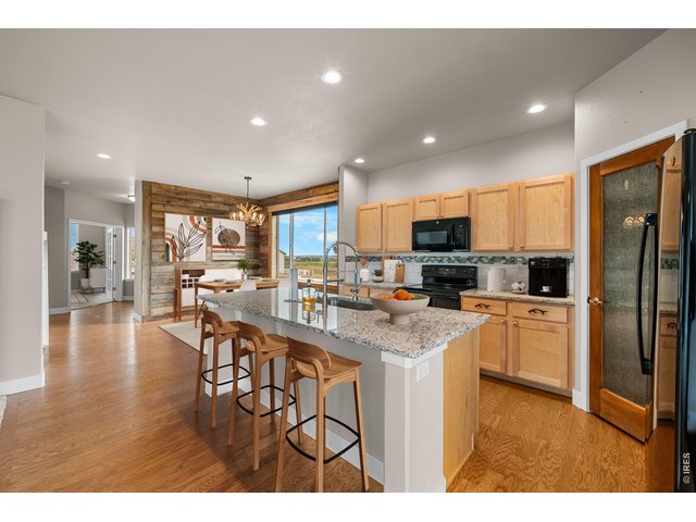 Property Photo 18 White Sparkle Granite Countertops with Ruby Red Flecks. Virtually Staged Photo.