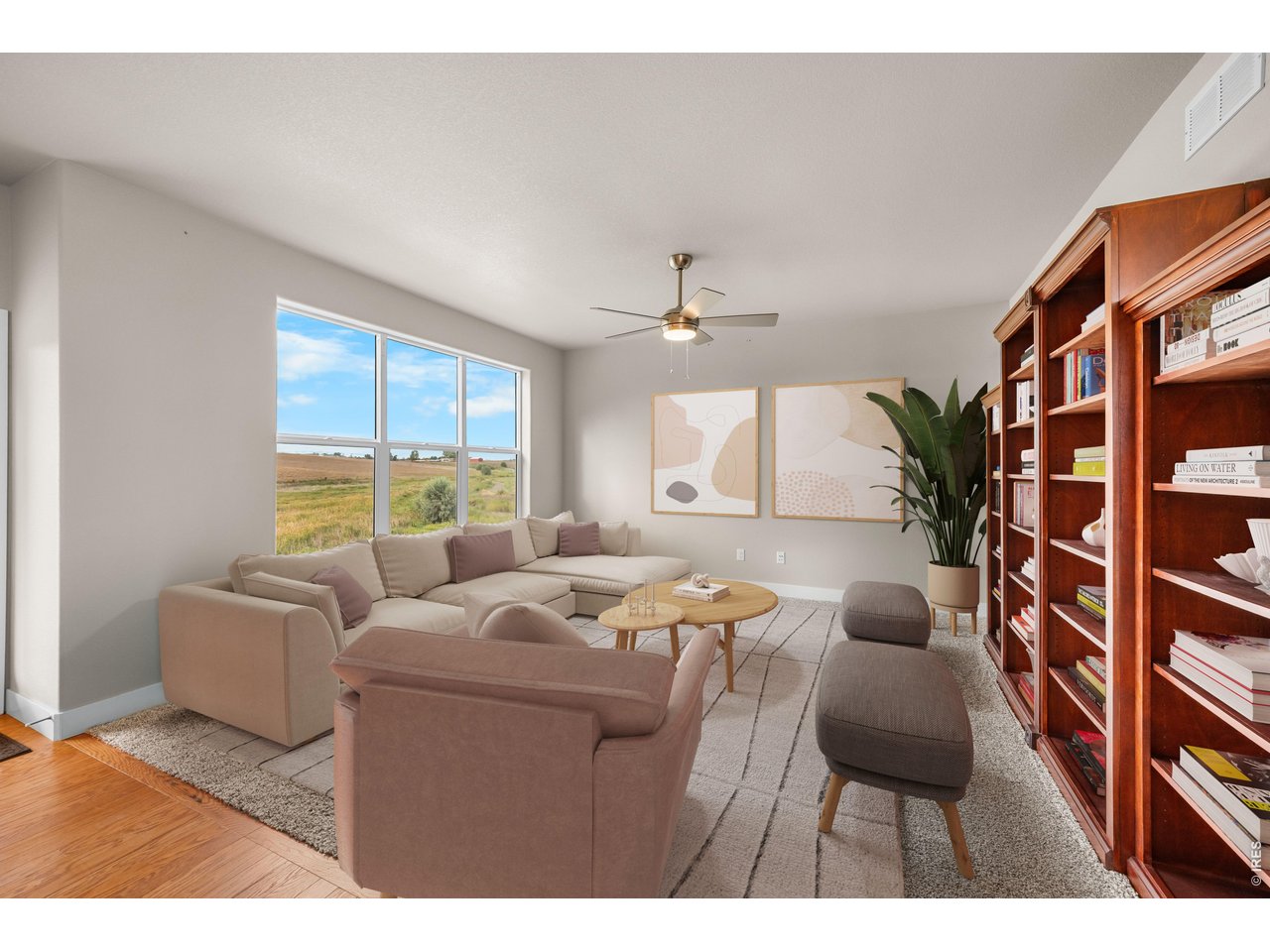 Property Photo 21 Adjoining Spacious Living Room with Large Windows for Southern Exposure...plants love this room!  Virtually Staged Photo.
