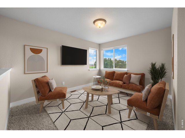 Property Photo 26 Upper Level Loft and TV or Video Room. Virtually Staged Photo.