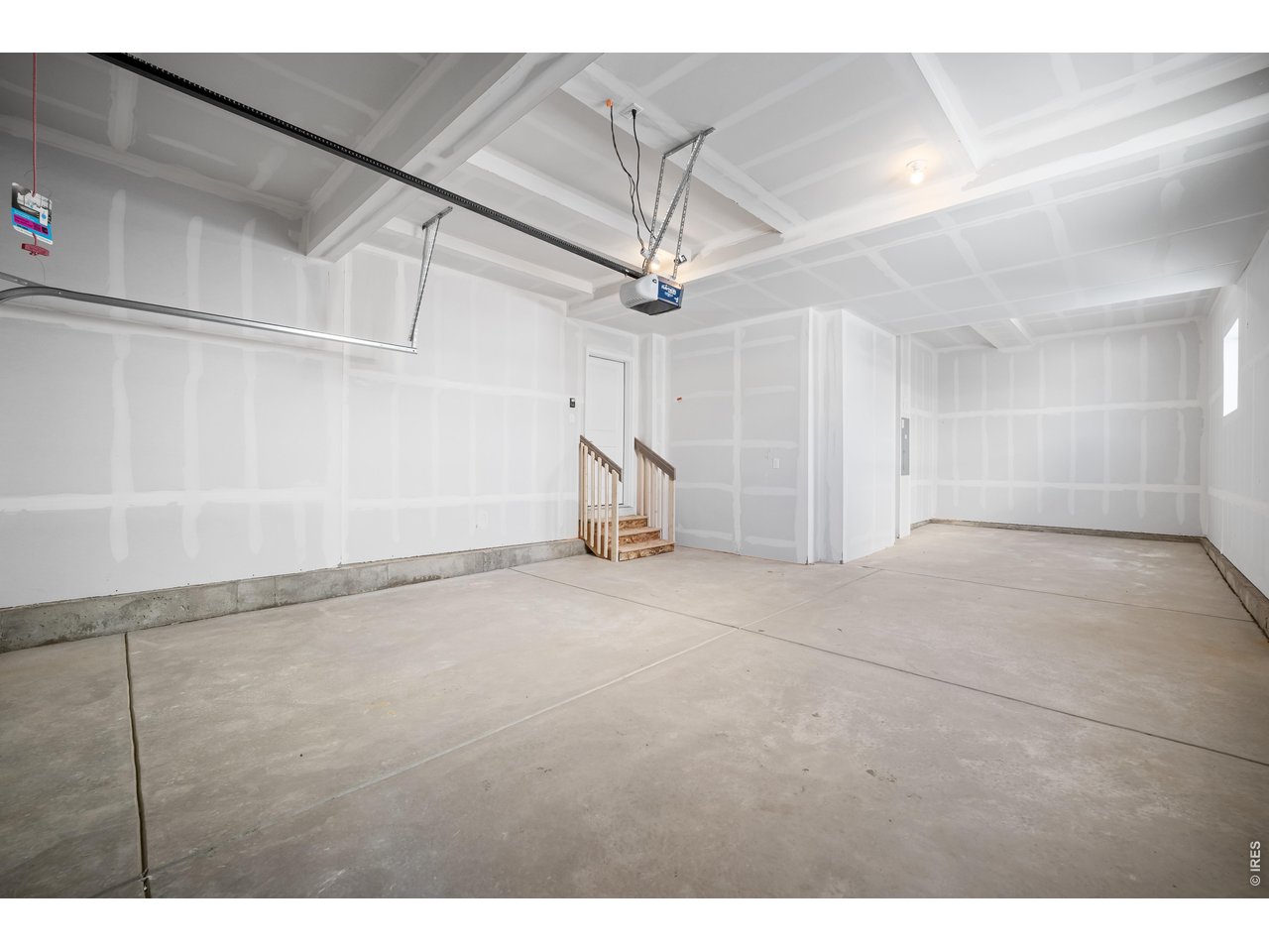 Property Photo 3 HUGE FINSIHED 3 CAR GARGE WITH 2 WEST FACING WINDOWS FOR PLENTY OF SPACE AND SUNLIGHT!