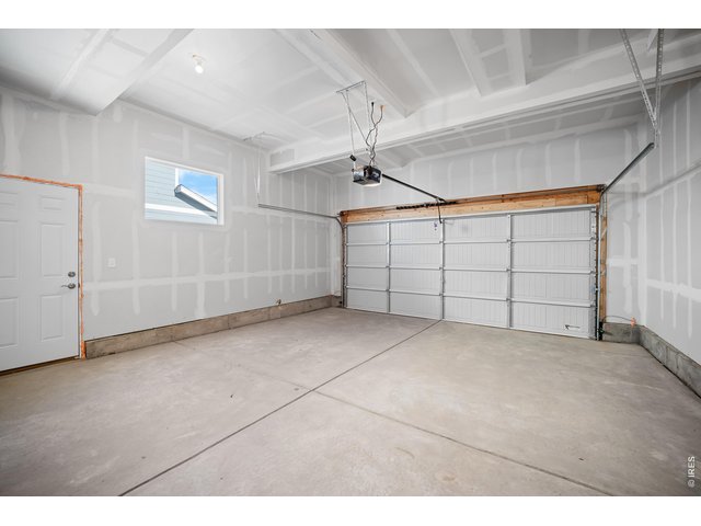 Property Photo 4 Another view of the oversized Garage and side  garage exit door to sideyard.