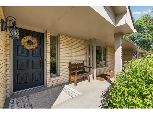 Property Photo 6 Covered front porch. Come on in!