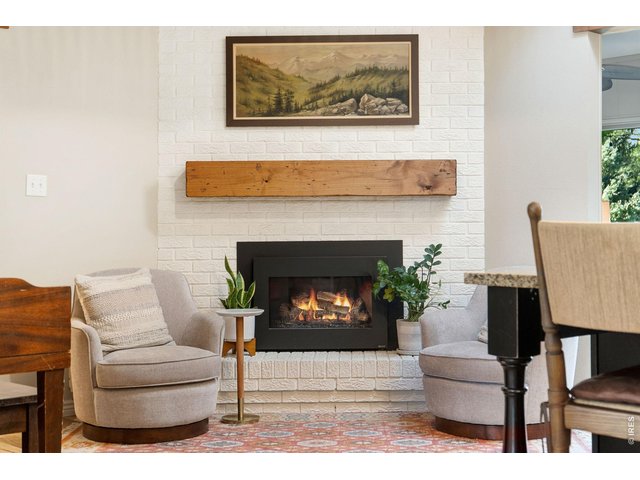 Property Photo 21 Hearth area with gas fireplace and wood mantle.