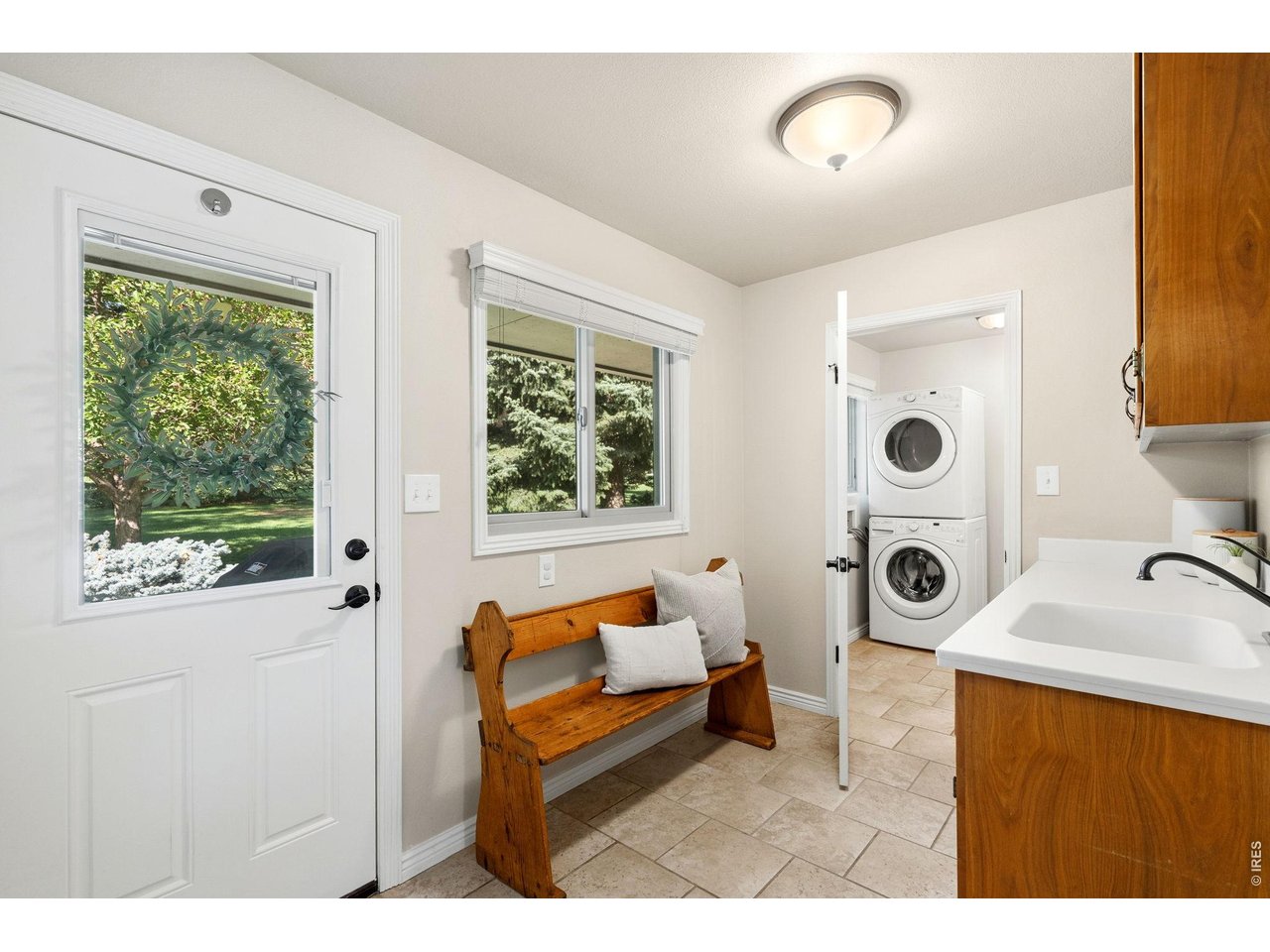 Property Photo 37 Mudroom door to bbq patio out back, and looking into powder bath and laundry.