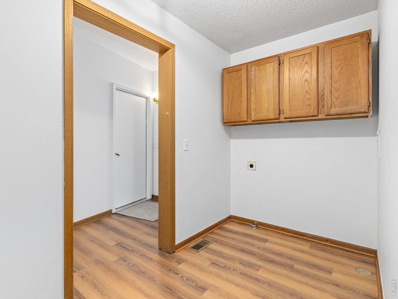 Property Photo 32 Laundry area with storage and new flooring