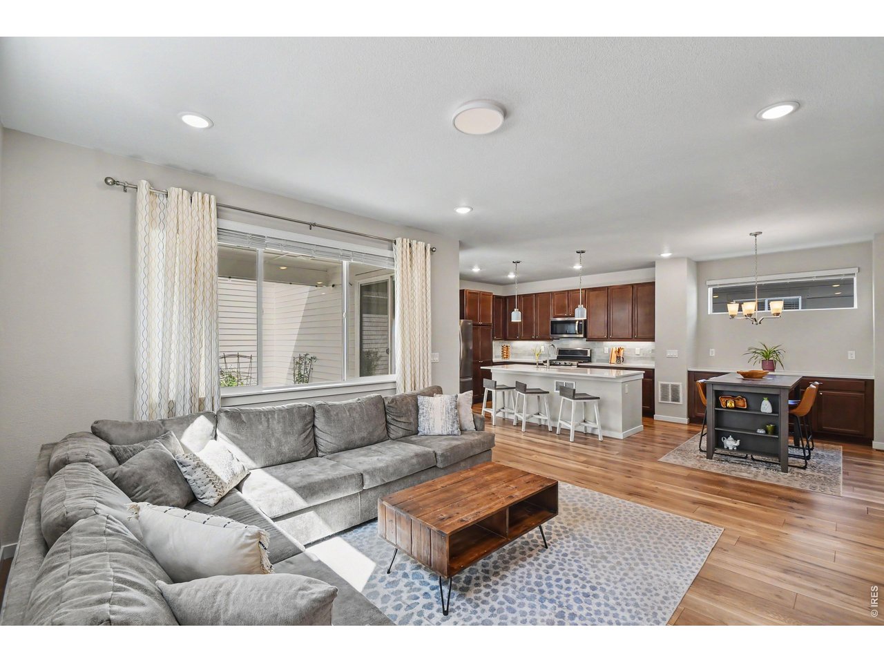Property Photo 3 Open floor plan with engineered wood throughout main leve.