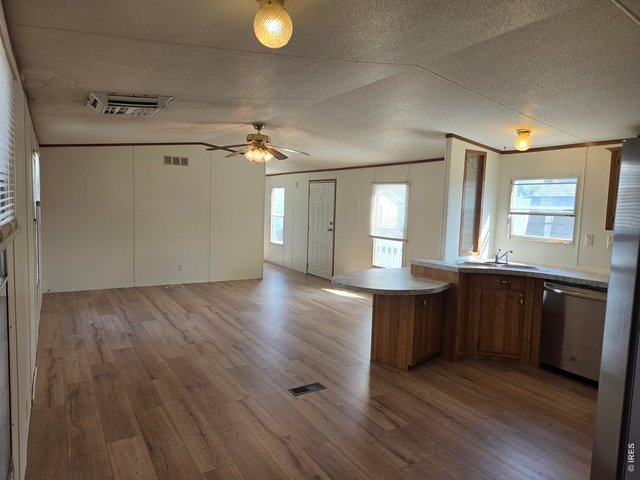 Property Photo 6 Kitchen looking into living room