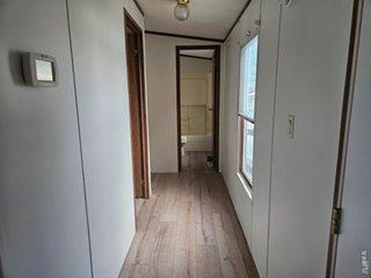 Property Photo 15 Hallway to Main bath, bedroom 2 & 3