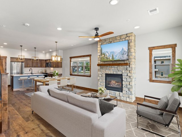 Property Photo 3 The open-concept main level creates a warm and inviting space for everyday living and entertaining, with a modern layout that takes full advantage of the surrounding mountain setting.