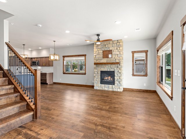 Property Photo 5 From the moment you step inside, you'll appreciate the attention to detail, including quartz countertops, solid wood trim and doors, and the comfort of central air conditioning.