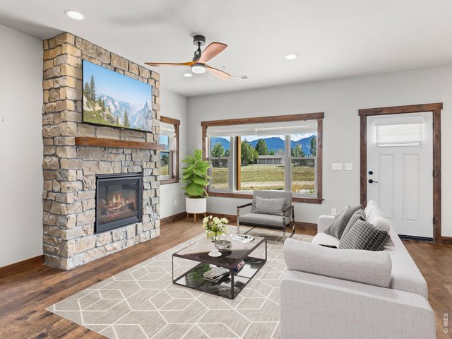 Property Photo 4 Gas log fireplace in the living room.