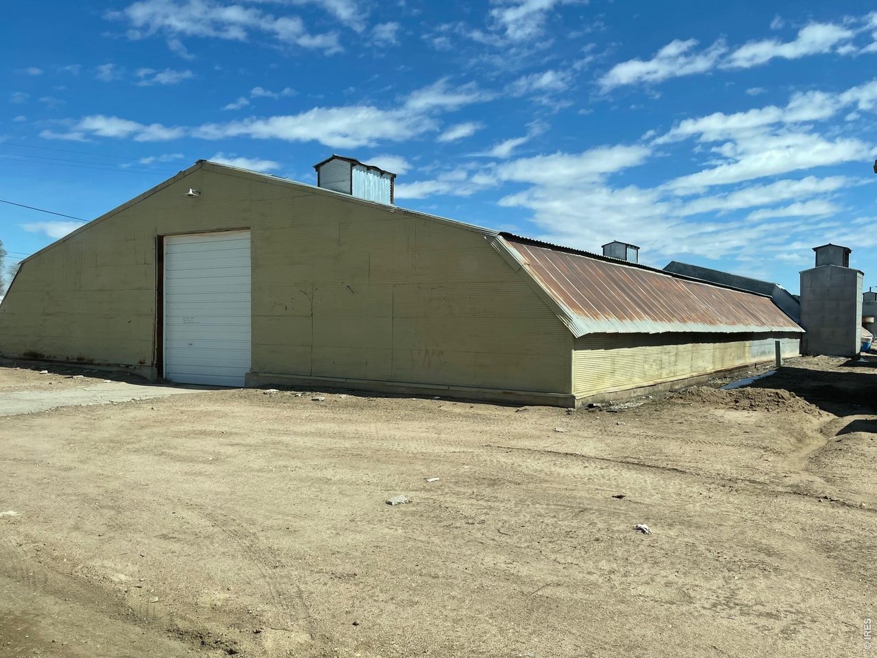 Property Photo 2 Building #2 Storage Warehouse is naturally climate controlled for consistent temperature & light control year around, 2" water tap, 19,909 sq. ft.