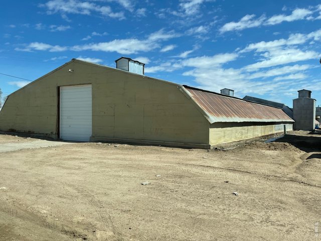 Property Photo 2 Building #2 Storage Warehouse is naturally climate controlled for consistent temperature & light control year around, 2" water tap, 19,909 sq. ft.