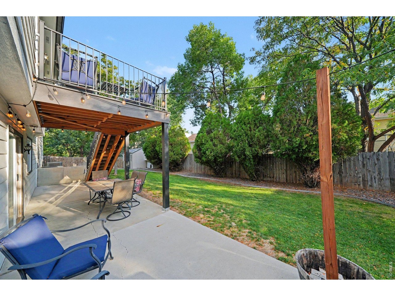 Property Photo 32 Expansive concrete lower patio sheltered by the deck above, perfect for outdoor dining and entertaining.
