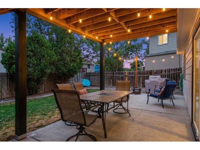 Property Photo 35 Golden hour vibes under the patio lights   Cozy outdoor living at its finest.