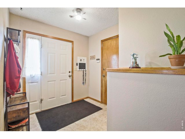 Property Photo 4 Front entry way with access to the 2 car garage