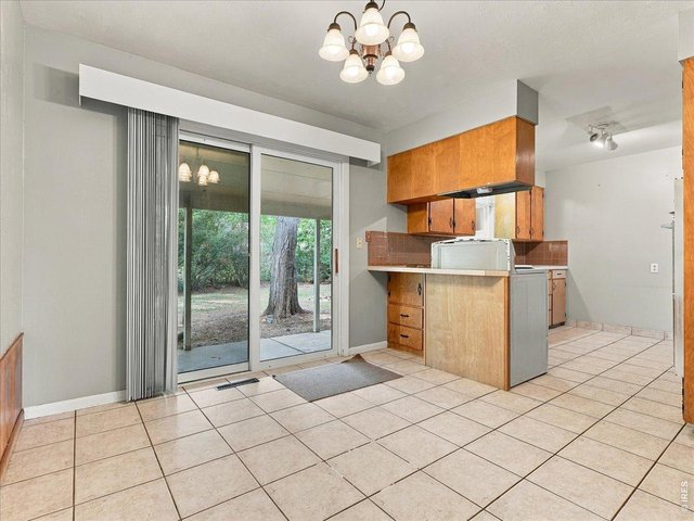 Property Photo 6 dining area to kitchen view