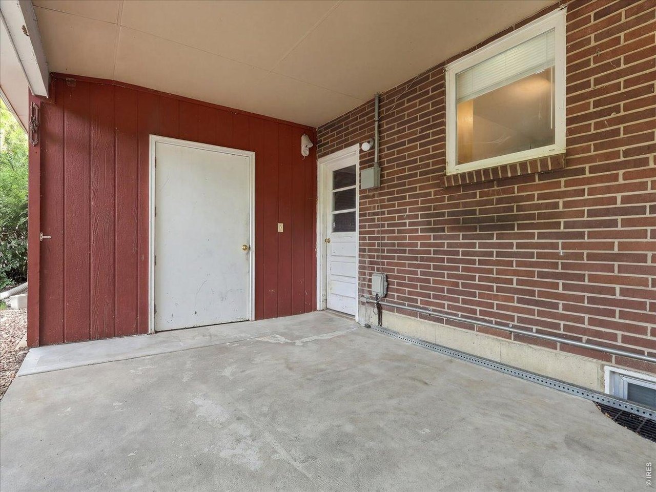 Property Photo 37 storage room and white door with window is to the garage