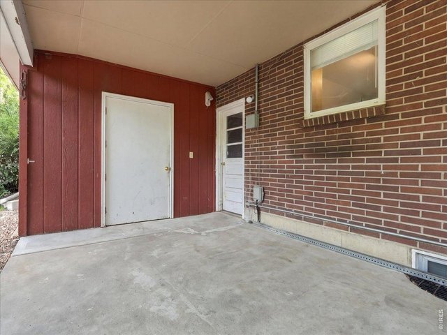 Property Photo 37 storage room and white door with window is to the garage