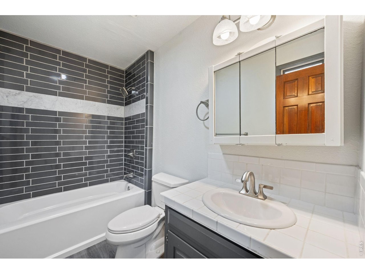 Property Photo 23 Updated private primary bathroom.