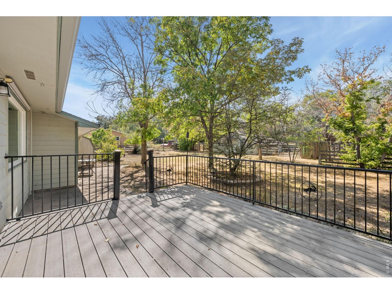 Property Photo 24 Back deck with low-maintenance composite decking.