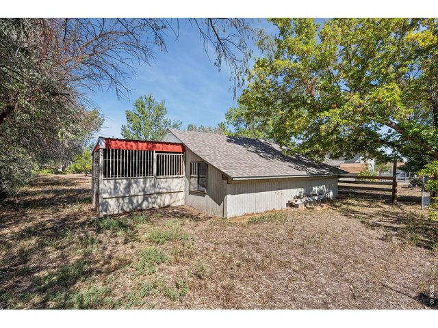 Property Photo 25 Horse stall conveniently located behind the shop.