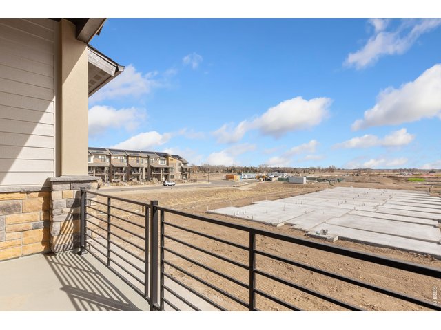 Property Photo 6 Private, covered patio with metal railing